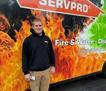 man standing in front of vehicle.