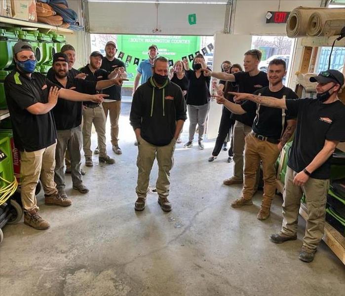 Crew Pointing at SERVPRO Production Manager 